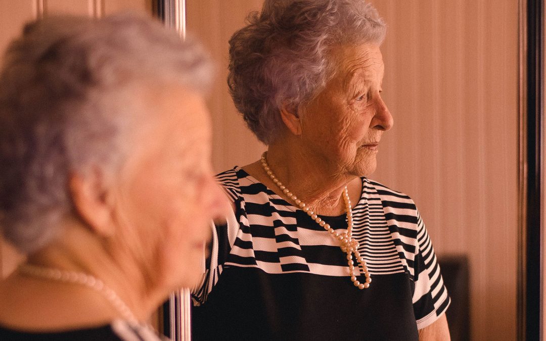 Senior women with dementia dressed with pearls